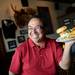 MLive.com's John Gonzales smiles as he poses for a photograph with his namesake "Gonzo" burger at Sidetrack on Wednesday, June 12, 2013. Melanie Maxwell | AnnArbor.com